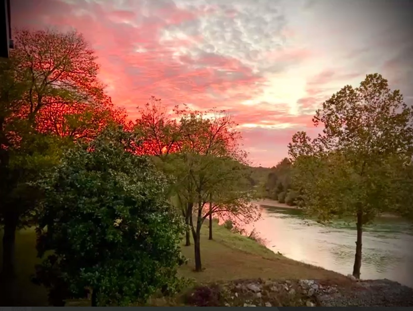 Sunset on the Current River with boating and fishing lifestyle